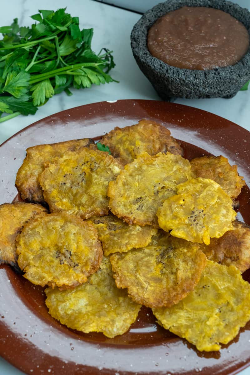 Transfer to another paper towel-lined plate and season with coarse sea salt. Enjoy these Dominican Tostones de Platano. 