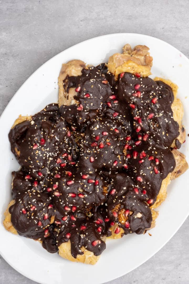 This Dona Maria Chicken Mole is made with chicken, Dona Maria mole, chicken broth, butter, chicken bouillon, pomegranate and sesame seeds. 