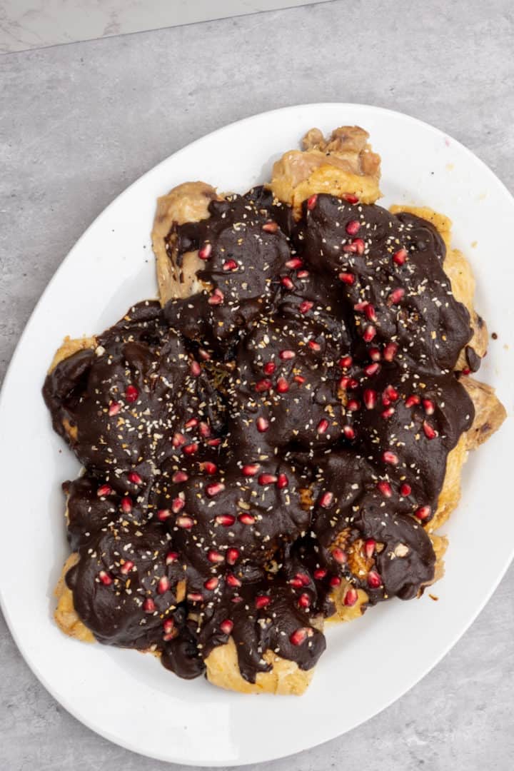 This Dona Maria Chicken Mole is made with chicken, Dona Maria mole, chicken broth, butter, chicken bouillon, pomegranate and sesame seeds. 