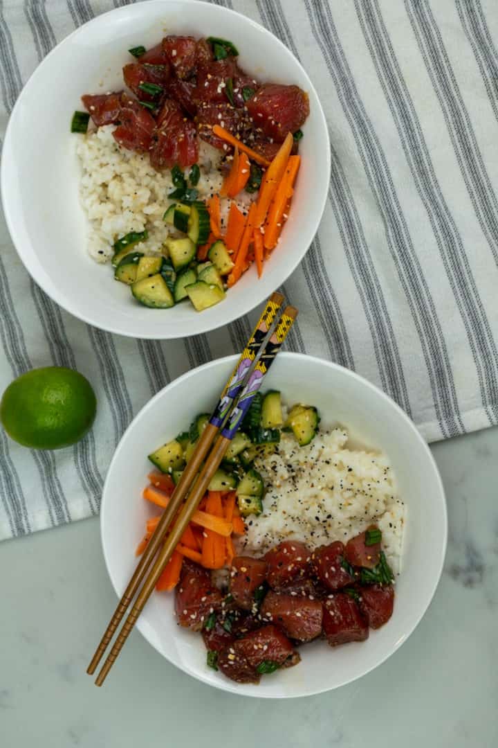 This Hawaii Poke has chunks of tuna, avocado, cucumber, carrots, sesame seeds, green onion soy sauce, sesame oil and spicy mayo!