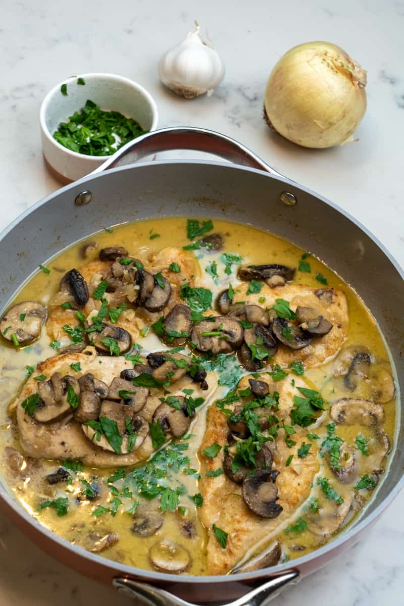Garnish with parsley and top with parmesan. Enjoy the Chicken Marsala (Keto and Gluten Free)!