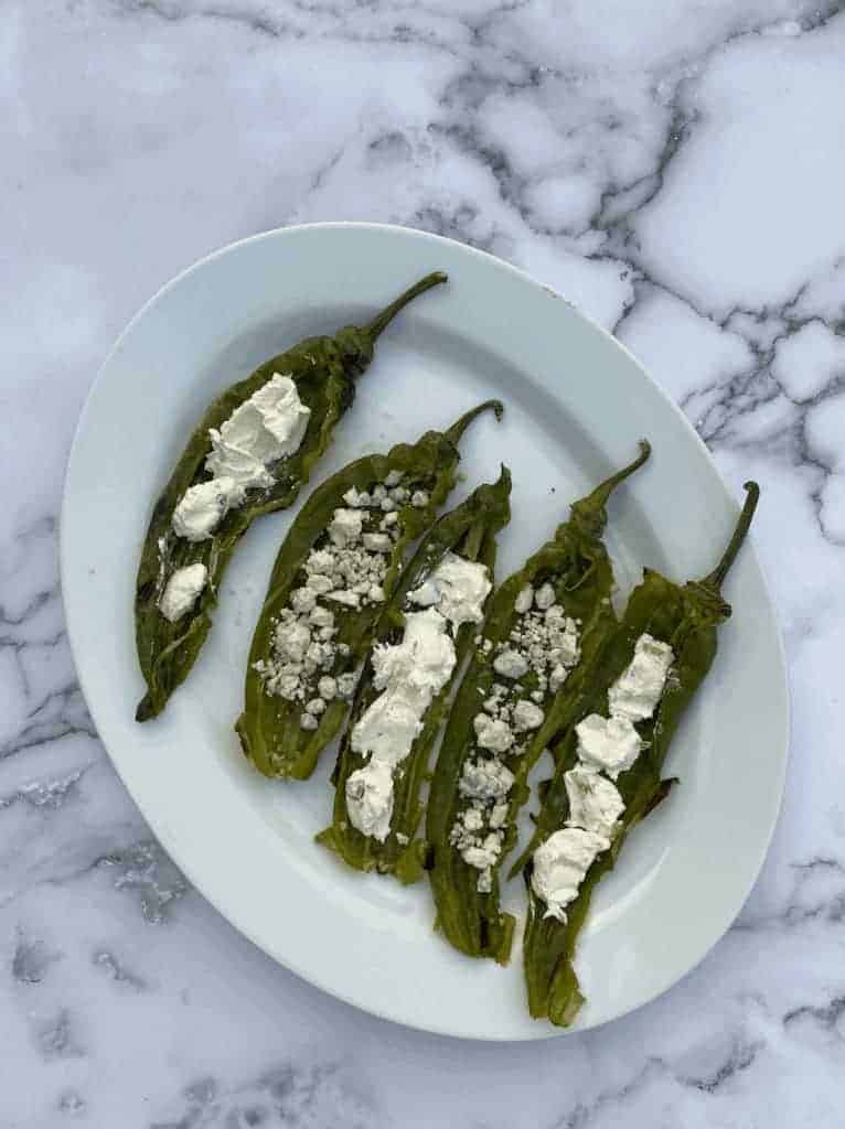 This Blue & Cream Cheese Stuffed Anaheim Peppers is made with anaheim peppers, cream cheese, blue cheese, and salt.