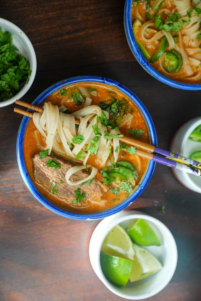 To serve, place a portion of cooked rice noodles in each bowl. Ladle the curry pork soup over the noodles.Garnish each bowl with fresh cilantro leaves, lime wedges, and sliced serrano peppers for a burst of flavor and color. Enjoy this Coconut Curry Soup Recipe. 