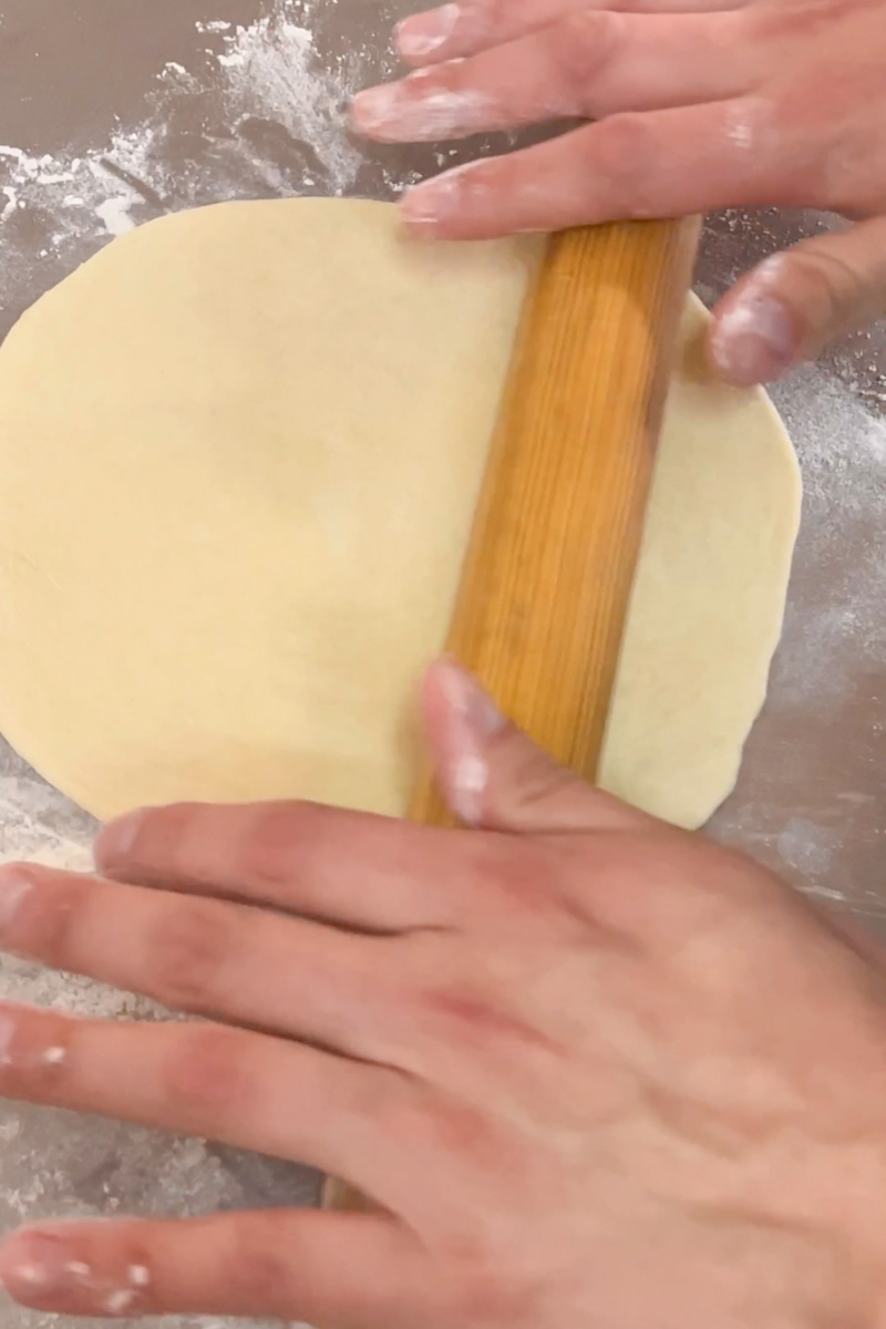  Using a floured rolling pin and a floured surface, toll the ball into a thin round tortilla.  Place the tortilla on a hot cast iron or skillet, around medium high heat, and cook until bubbly and golden, about 2 minutes. 