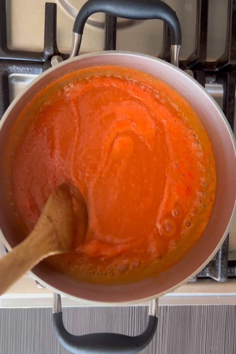 Feel free to use some of that boiled water to blend and adjust to your desired consistency. Pour the sauce back in a pan and bring to a simmer for 15 minutes. You may add ½ cup of water if needed.