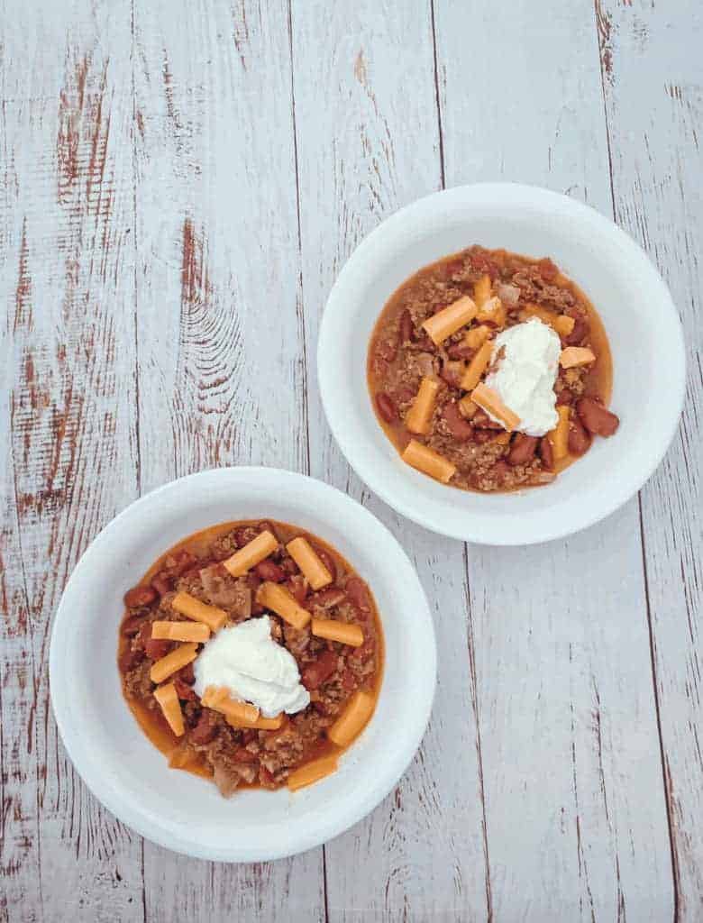 This Instant Pot Chili is made with ground beef, red kidney beans, tomatoes, onion, habaneros, and a packet of taco seasoning. 