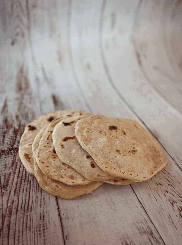 I bet you are wondering how to make Vegan Flour Tortillas? All you need is flour, salt, baking powder, vegetable shortening and water.