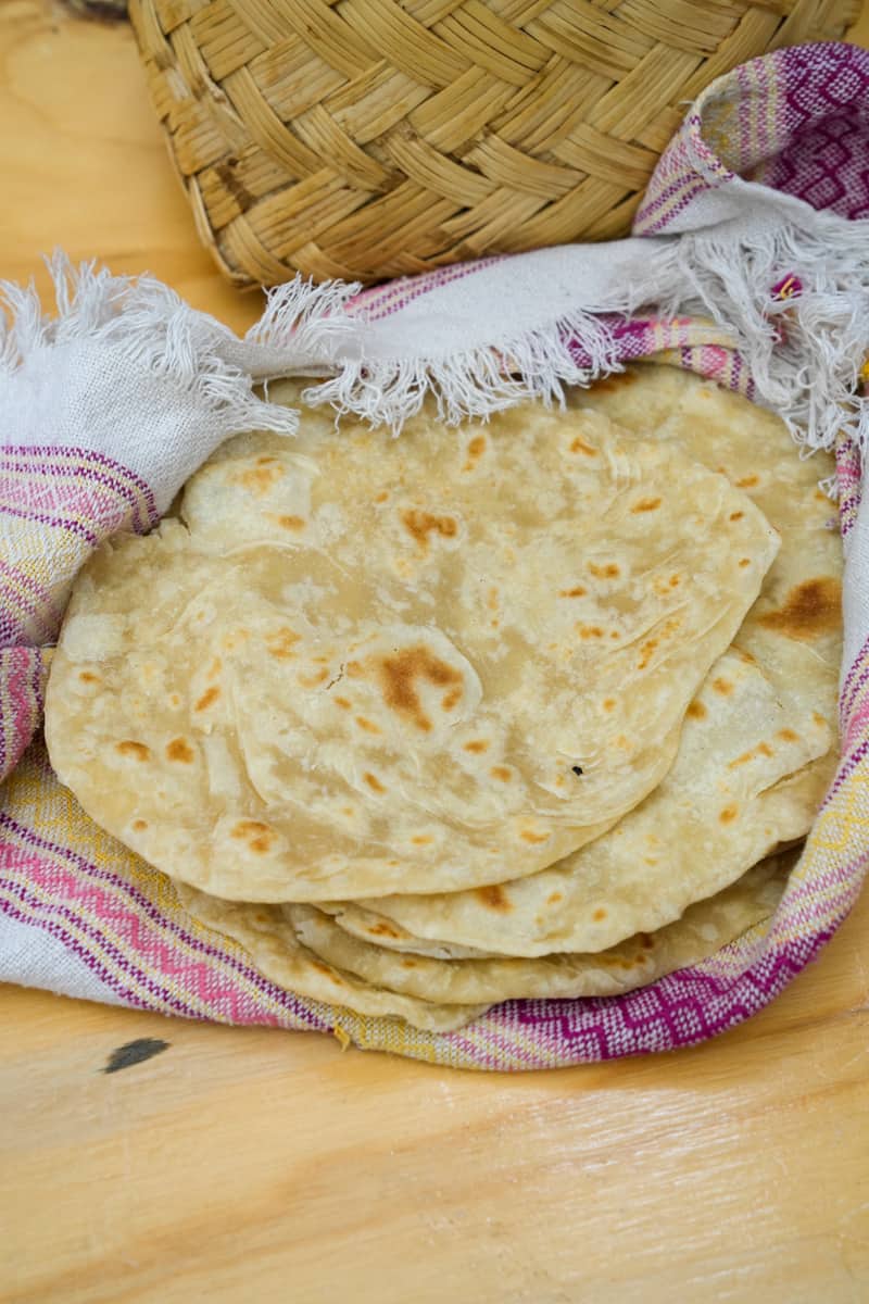 Wondering how to make an Authentic Flour Tortilla Recipe from scratch? This is the simplest recipe: All you need is flour, salt, baking powder, pork lard and hot water. 