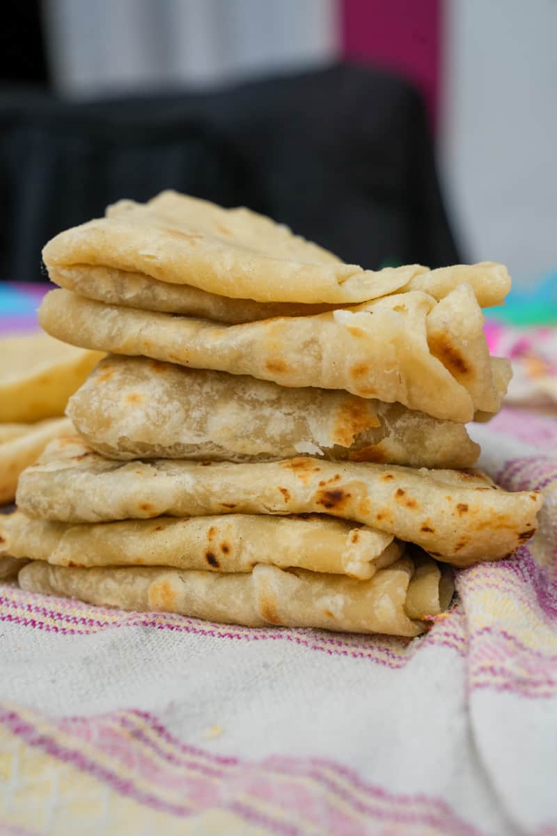 Wondering how to make an Authentic Flour Tortilla Recipe from scratch? This is the simplest recipe: All you need is flour, salt, baking powder, pork lard and hot water. 