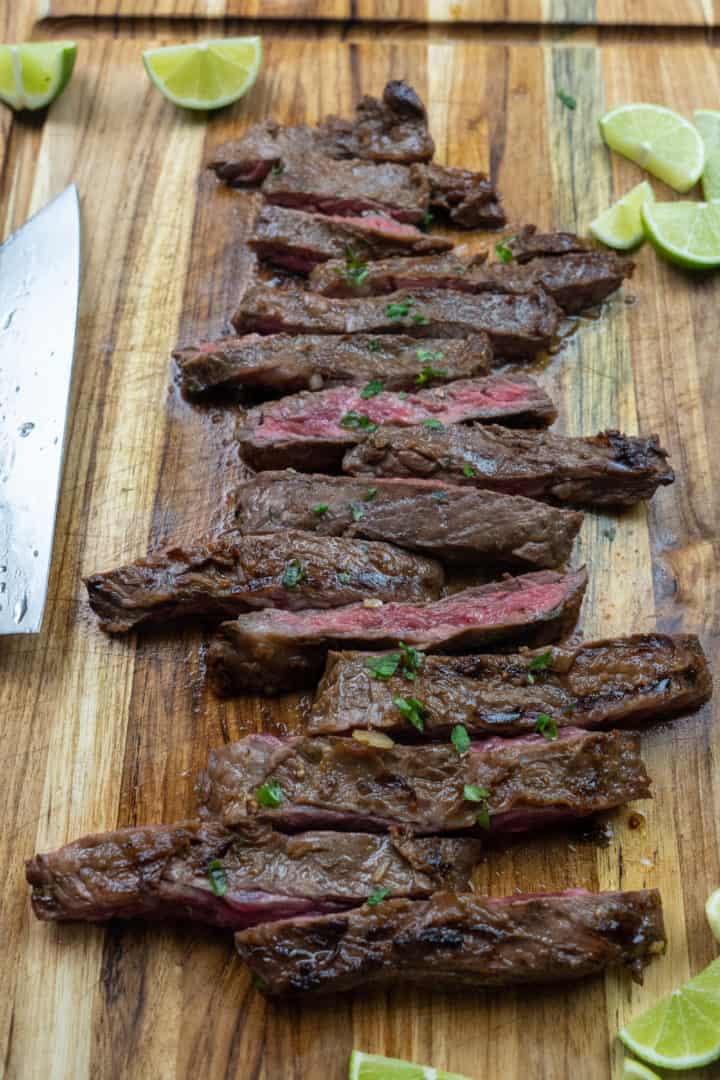 This Cast Iron Carne Asada is made with Ranchera Meat, olive oil, soy sauce, apple cider vinegar, jalapeños, onion, and limes.