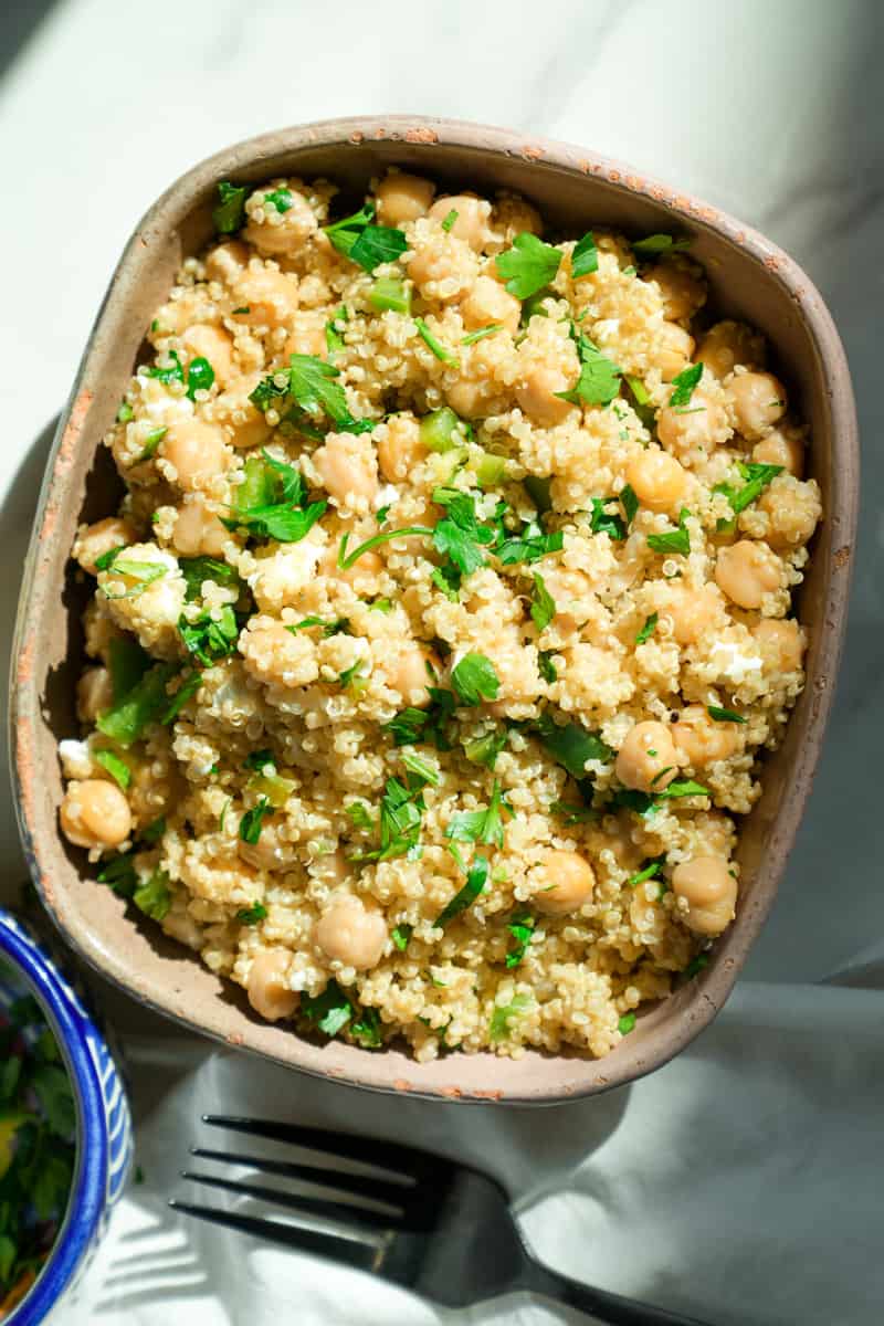 This Instant Pot Quinoa with Chickpeas is made with garbanzo beans, feta cheese, bell pepper, quinoa, chicken broth, and red wine vinegar. 