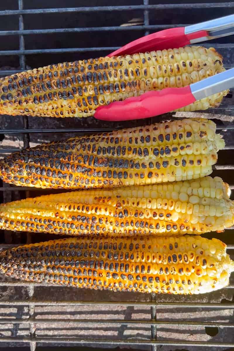 In a small bowl, combine the melted butter and lime zest. With a brush, spread the mixture onto the corn.