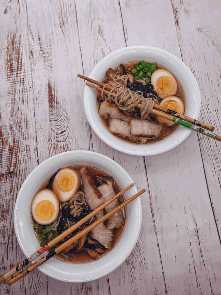 This Tonkotsu Shoyu Ramen is made with pork belly, ramen, shitake mushrooms, kombu, bonito flakes, soft boiled eggs and scallions.