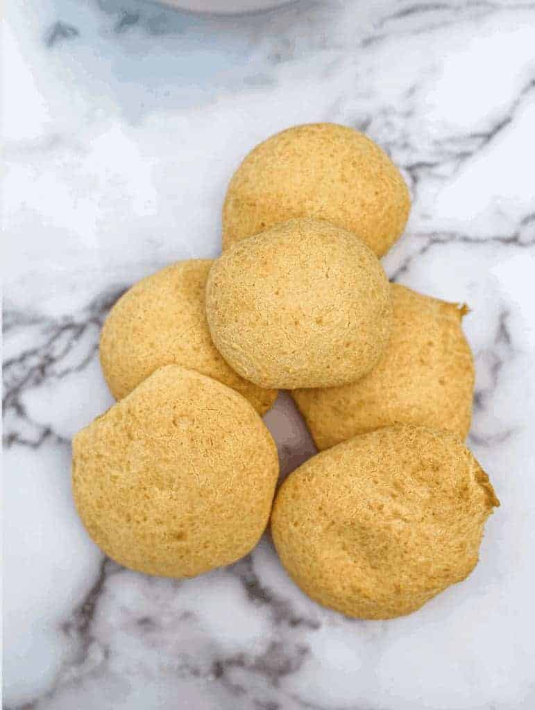 This Pao de Queijo (Brazilian Cheese Bread) is made with butter, water, milk, tapioca flour, parmesan cheese, and eggs.