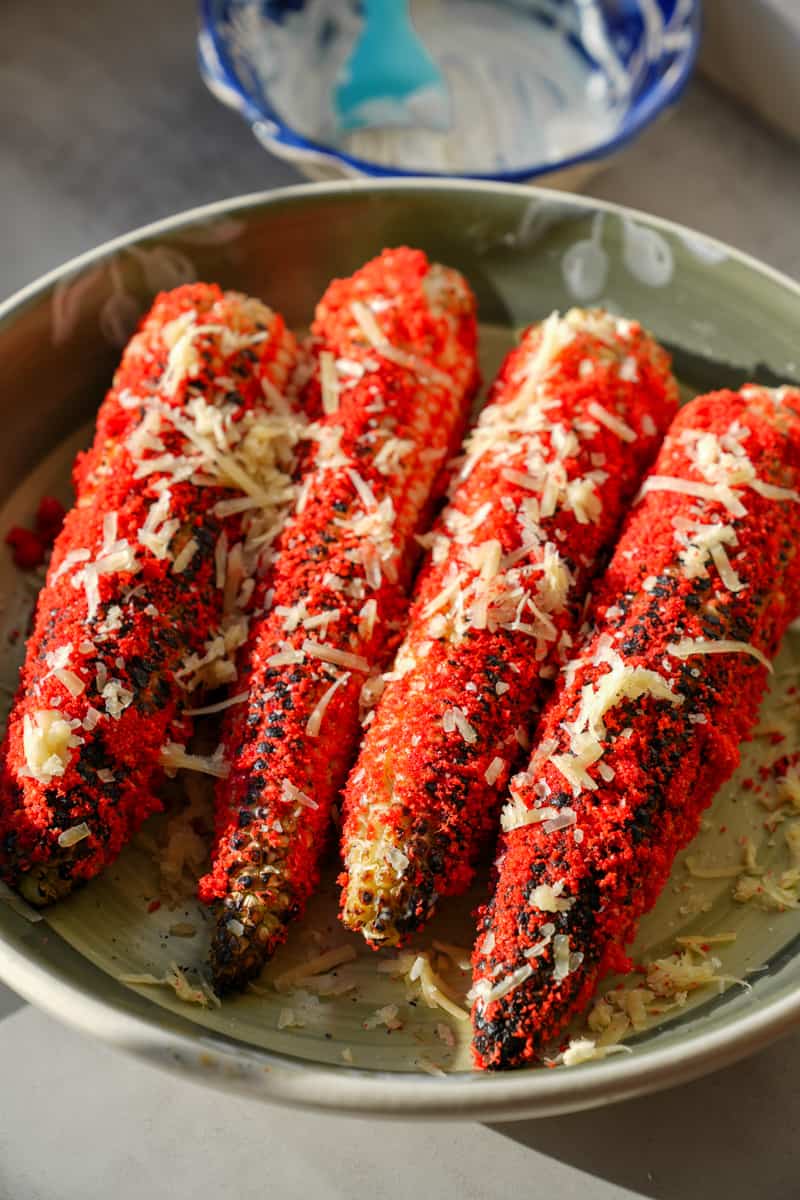 Top with cotjia cheese. Enjoy this Flamin Hot Cheetos Corn (Elote).