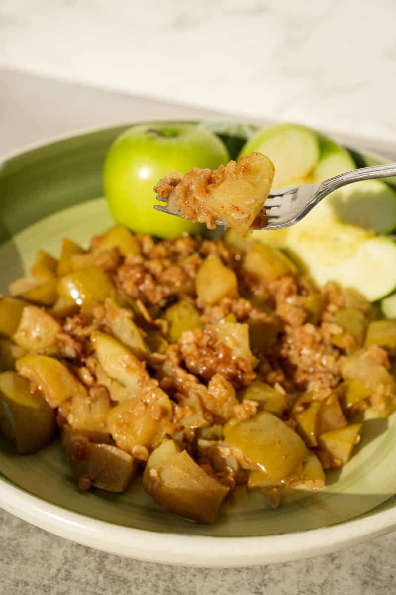 This Instant Pot Oatmeal Recipe with Apple is made with granny smith apples, maple syrup, cinnamon, oats, and melted butter.