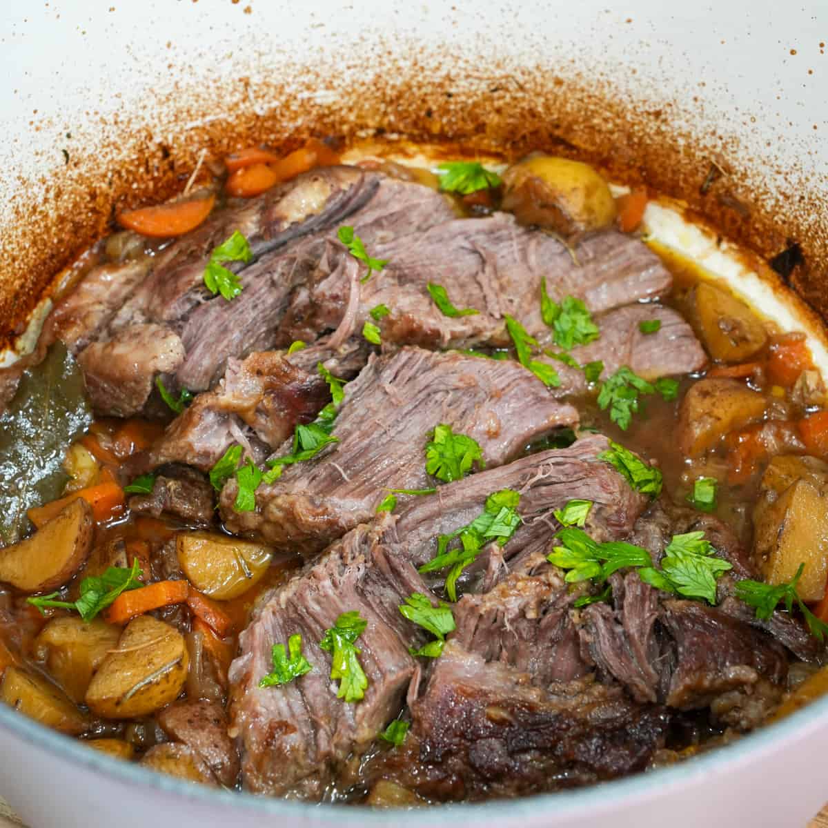 Experience comfort in every bite with our succulent pork pot roast: tender, slow-cooked pork infused with savory herbs and spices, nestled among hearty vegetables, and enveloped in rich, flavorful gravy.