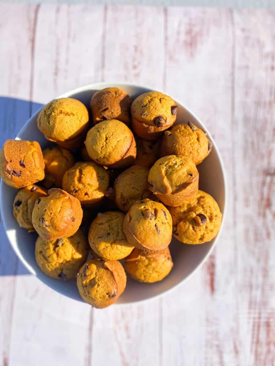 This Pumpkin Chocolate Chip Muffins Recipe is made with pumpkin, chocolate chips, flour, eggs, baking soda, cinnamon, sugar, and nutmeg.