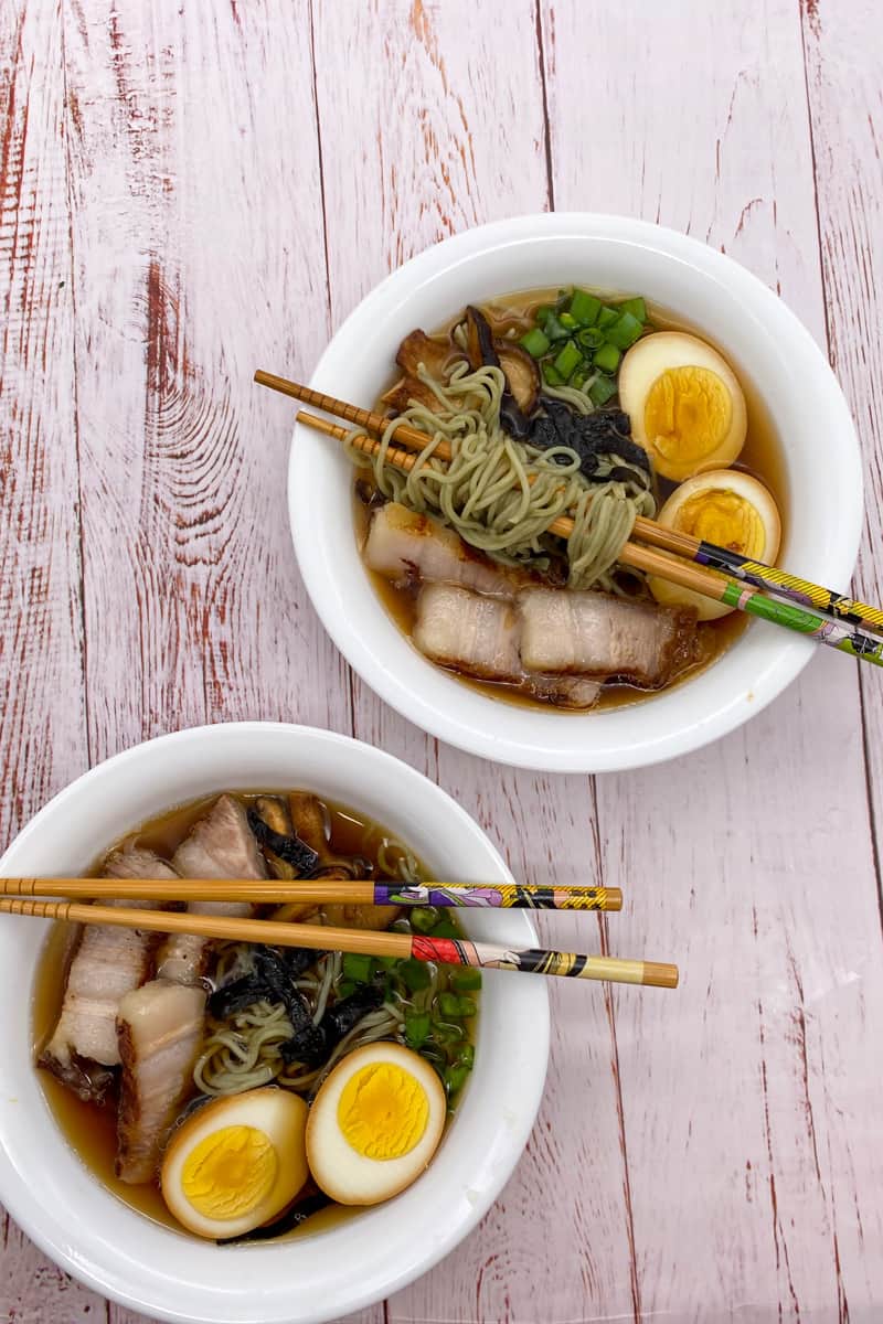 This Shoyu Ramen Recipe is made with pork belly, ramen, shitake mushrooms, kombu, bonito flakes, soft boiled eggs and scallions.