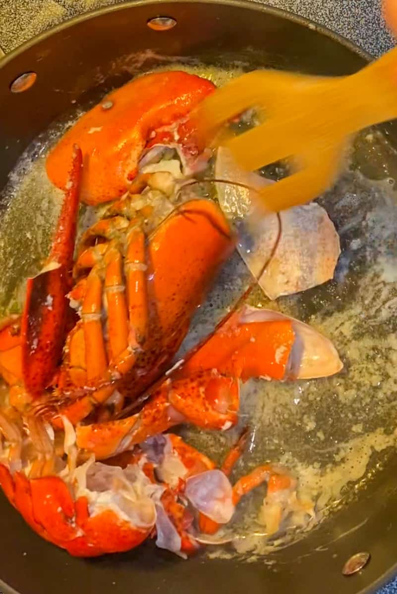 Crack the steamed lobster and remove the meat. Reserve the shells and meat separately. In a large deep saucepan (with cover) add the butter on medium heat and wait for it to melt. Sauté the lobster shells in the butter to flavor, roughly around 3-4 minutes. Remove the shells.