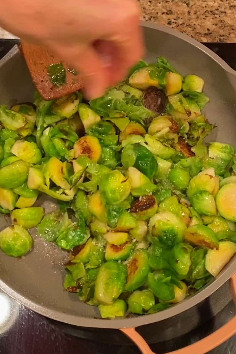 Stir in the minced garlic and cook for an additional 1-2 minutes until fragrant. Add the lemon zest and lemon juice to the skillet, stirring to coat the Brussels sprouts evenly. Season with salt and pepper to taste.