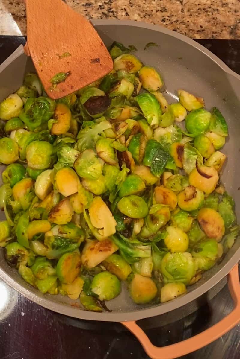 Reduce the heat to medium-low, cover the skillet, and cook for another 5-7 minutes, or until the Brussels sprouts are tender but still slightly crisp. Stir occasionally to ensure even cooking.
