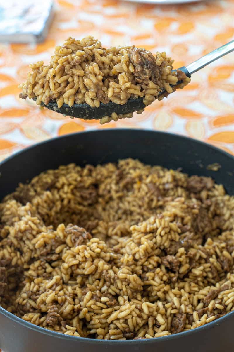 This Sausage and Mushroom Risotto Recipe is made with dried porcini mushrooms, sausage, onion, rice, rosemary, broth, and saffron.