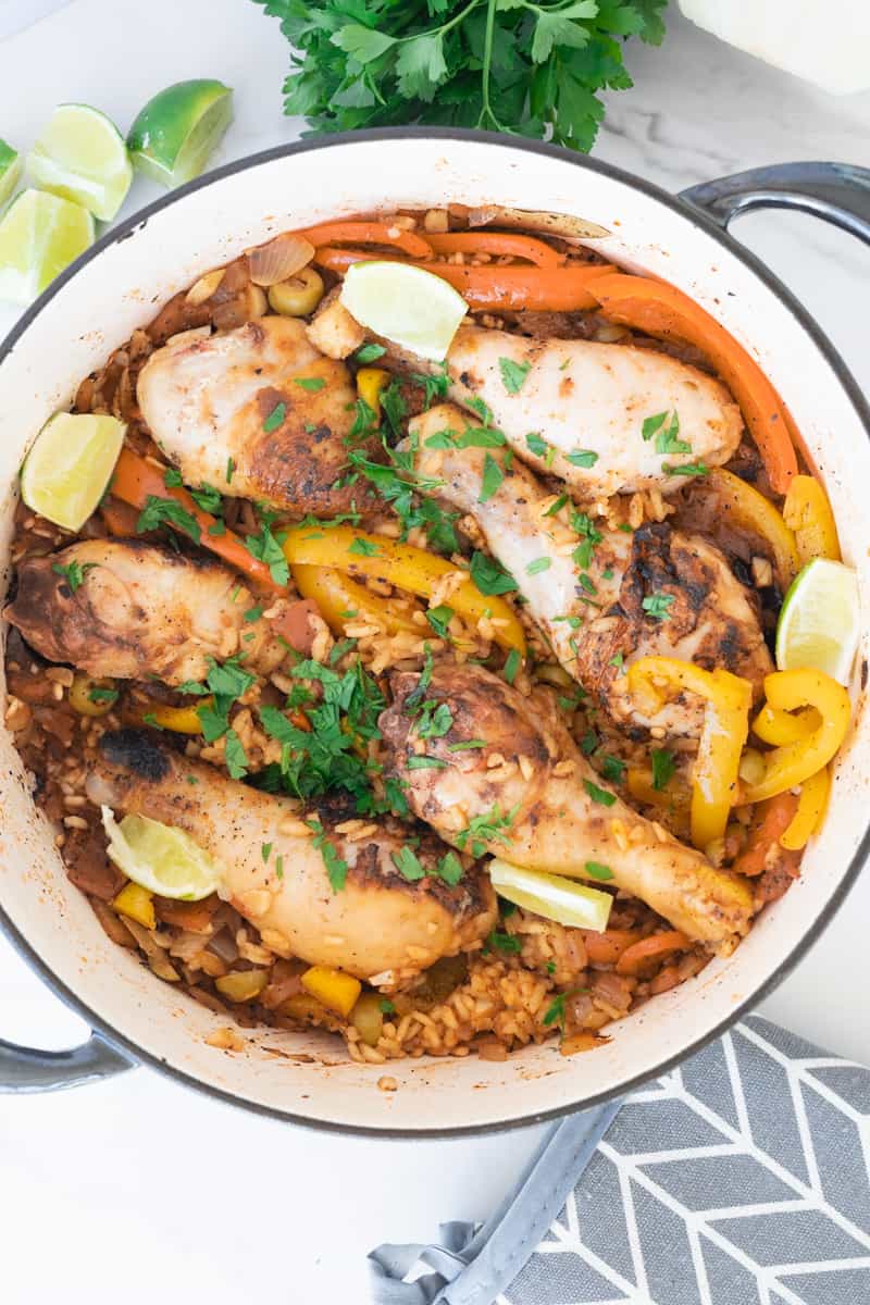This Cuban Arroz con Pollo is made with arborio rice, drumsticks, adobo, sofrito, saffron, peppers, broth and white wine. 