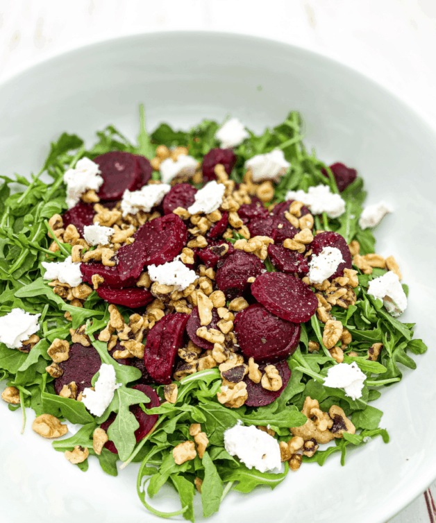 This Roasted Beets with Goat Cheese and Balsamic Salad is made with beets, walnuts, goat cheese, arugula, olive oil and vinegar.