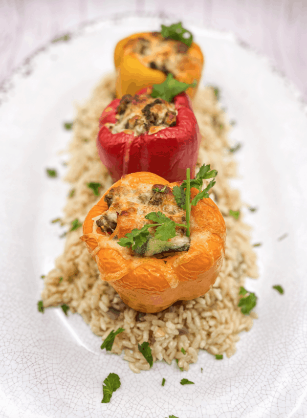 These Classic Easy Stuffed Peppers (Keto) are made with ground beef, onion, garlic, carrots, celery and tomatoes which are cooked and stuffed in bell peppers.