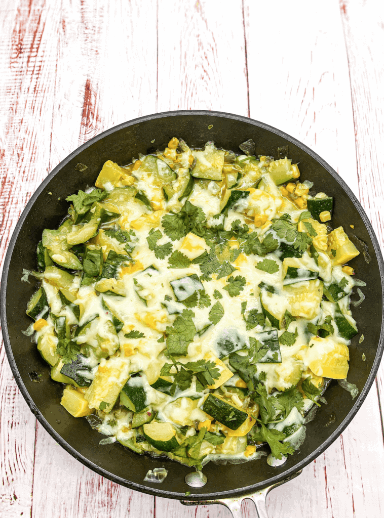 This Calabacitas con Elote is vegetarian dish made with zucchini, corn, cheese, cilantro and sauteed to perfection. 