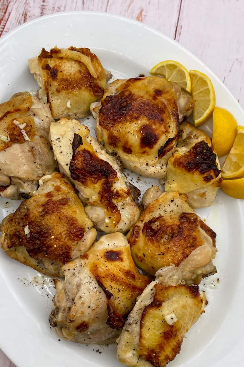 This Broiled Lemon Chicken Thighs Recipe is made with chicken thighs, lemons, red wine vinegar, garlic, and seasoned with oregano.