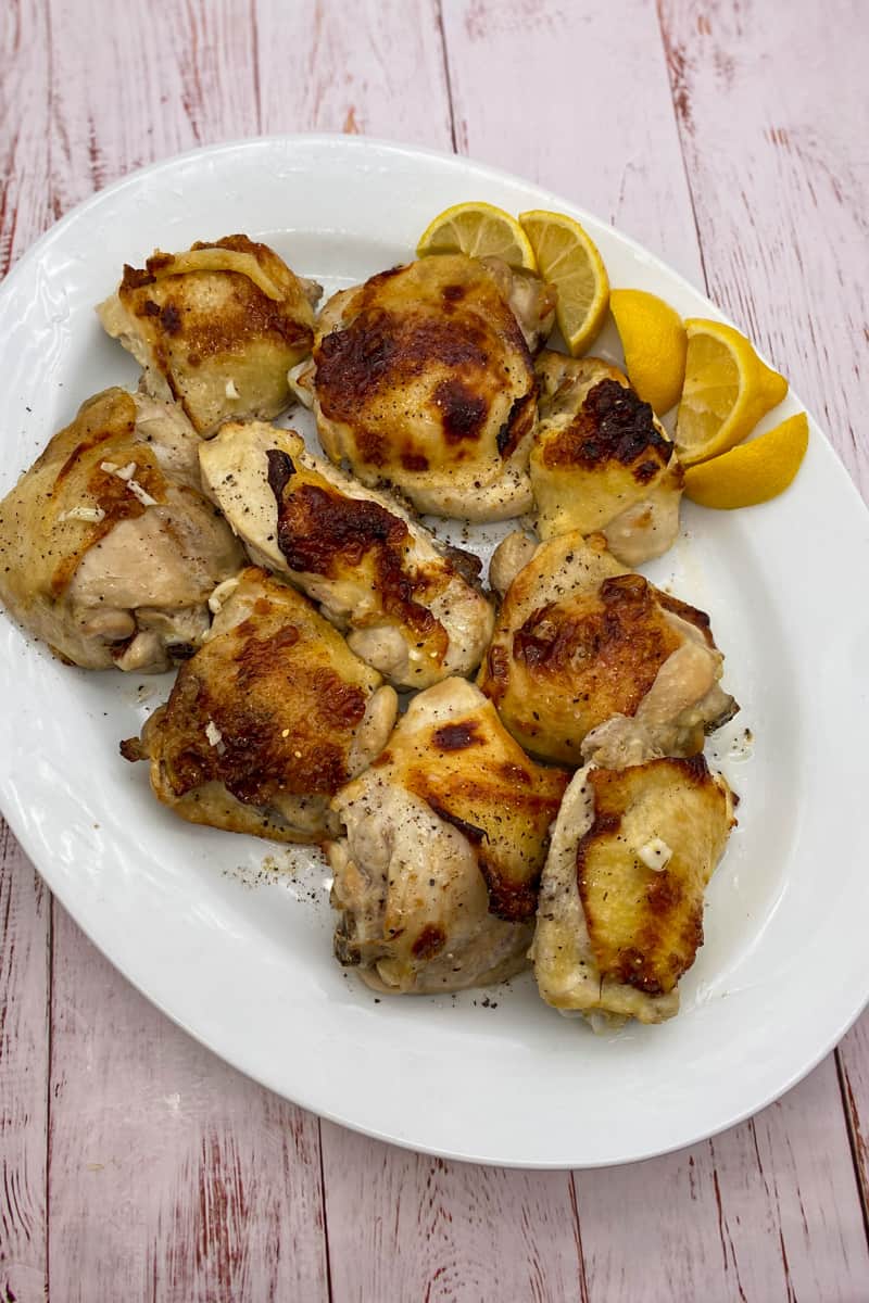This Broiled Lemon Chicken Thighs Recipe is made with chicken thighs, lemons, red wine vinegar, garlic, and seasoned with oregano.