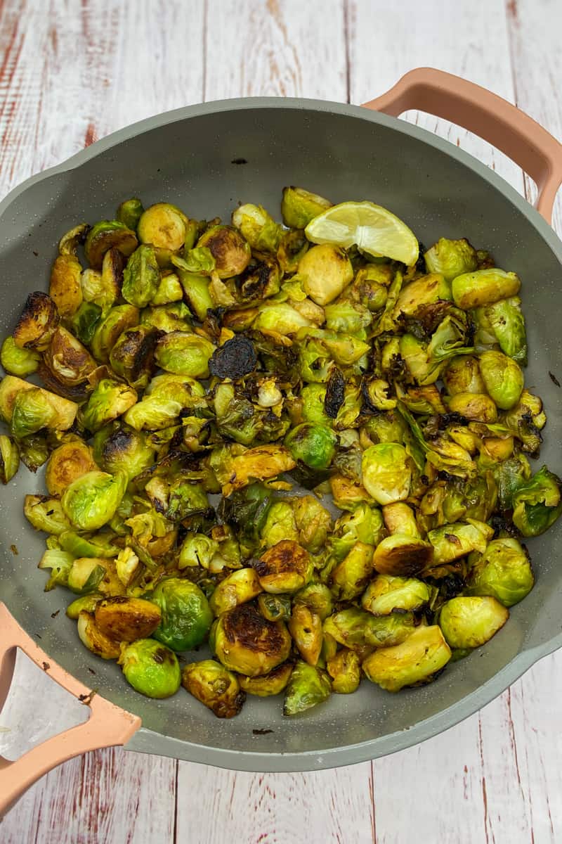 This Lemon Brussels Sprouts Recipe with brussels sprouts, olive oil, garlic, lemon, and sautéed to perfection. 