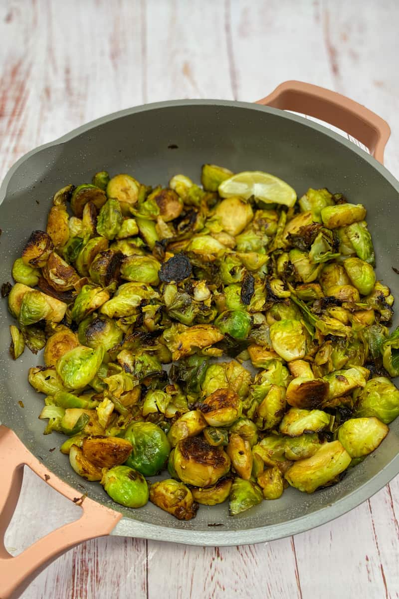 This Lemon Brussels Sprouts Recipe with brussels sprouts, olive oil, garlic, lemon, and sautéed to perfection. 