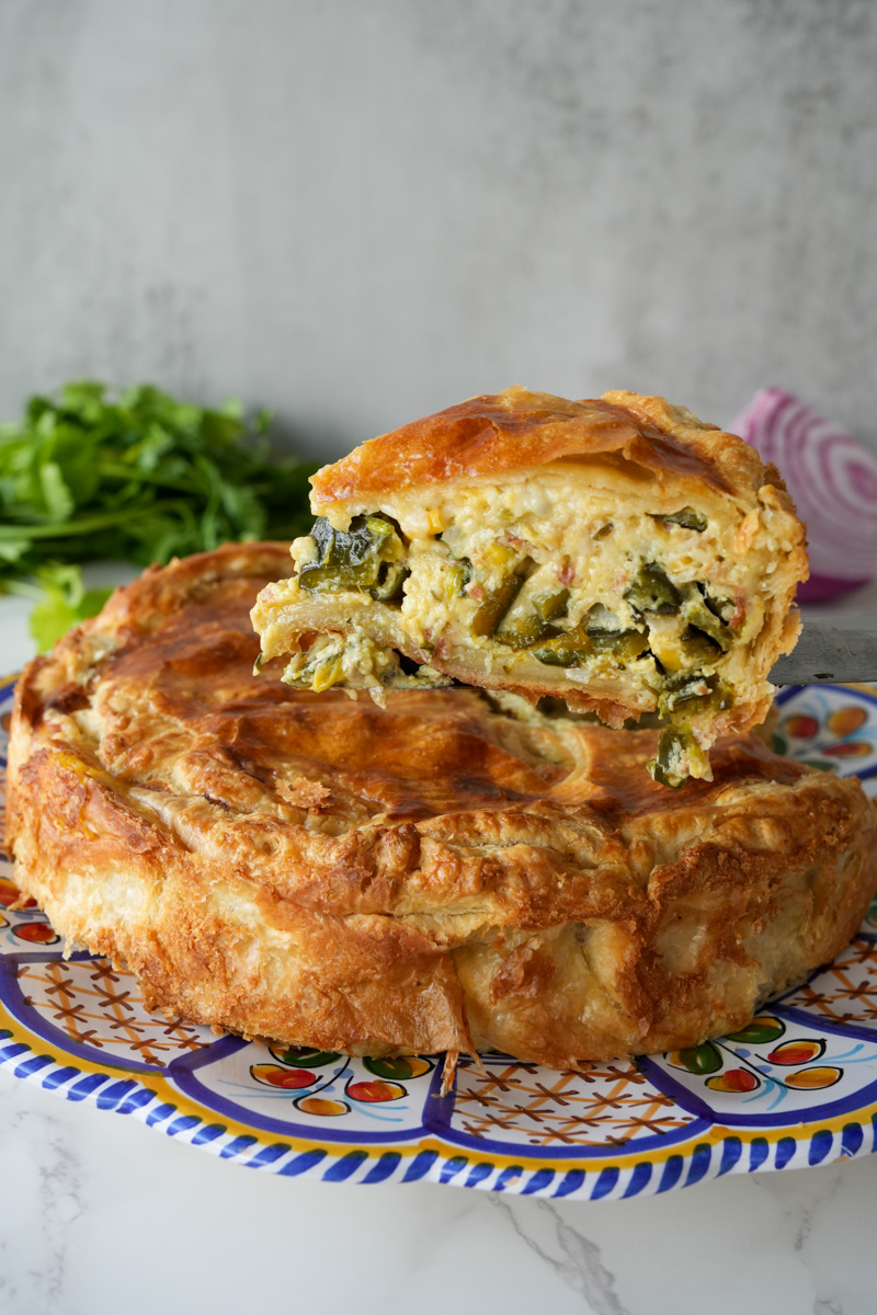 This Mexican Quiche Recipe is made with poblano peppers, bacon, cheese, onion, garlic, eggs, jalapeños, cilantro, and baked in a pie crust.