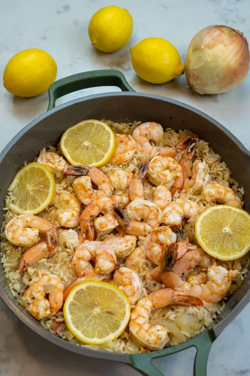 Sprinkle with fresh lemon juice, lemon zest, and lemon slices on the Cajun Shrimp and Rice Recipe. 