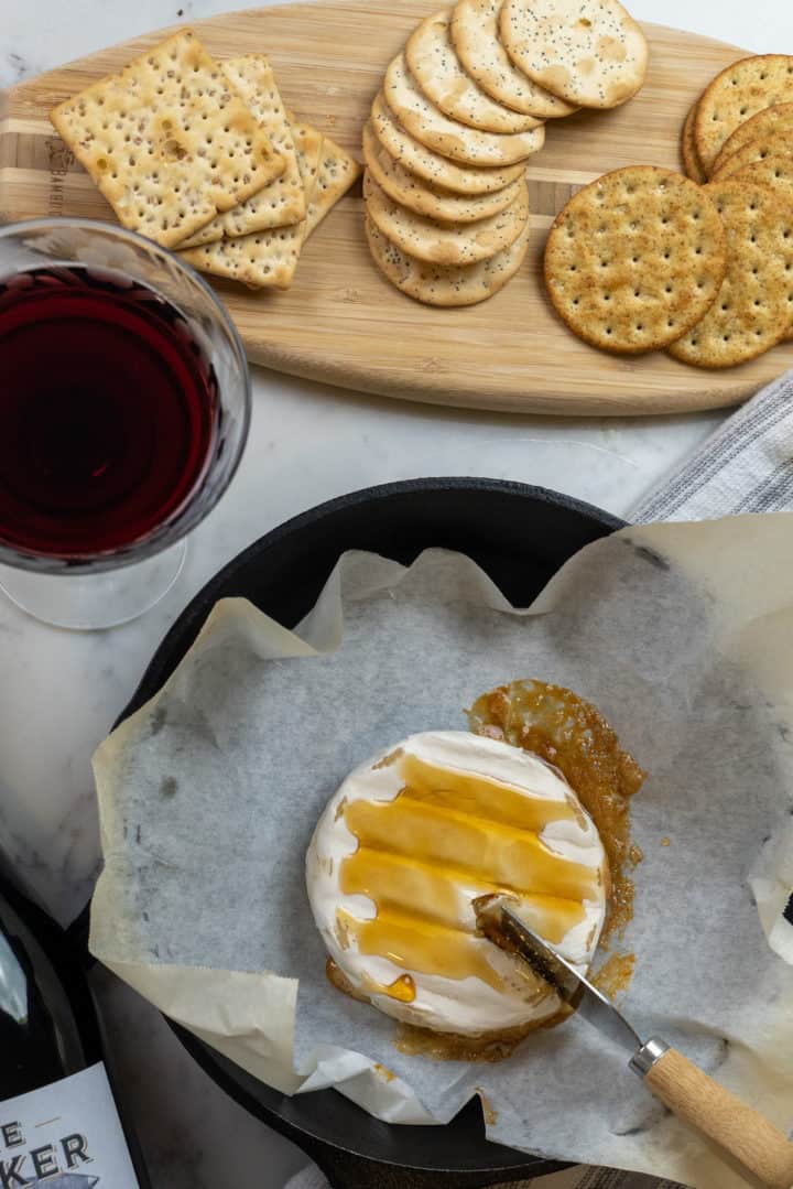 This Baked Brie Recipe that requires only three ingredients: brie, honey or fig jam and your choice of nuts.