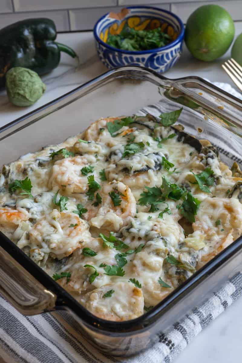 This Shrimp Poblano dish is made with shrimp, onion, garlic, salsa verde, poblano peppers sour cream and lots of cheese.