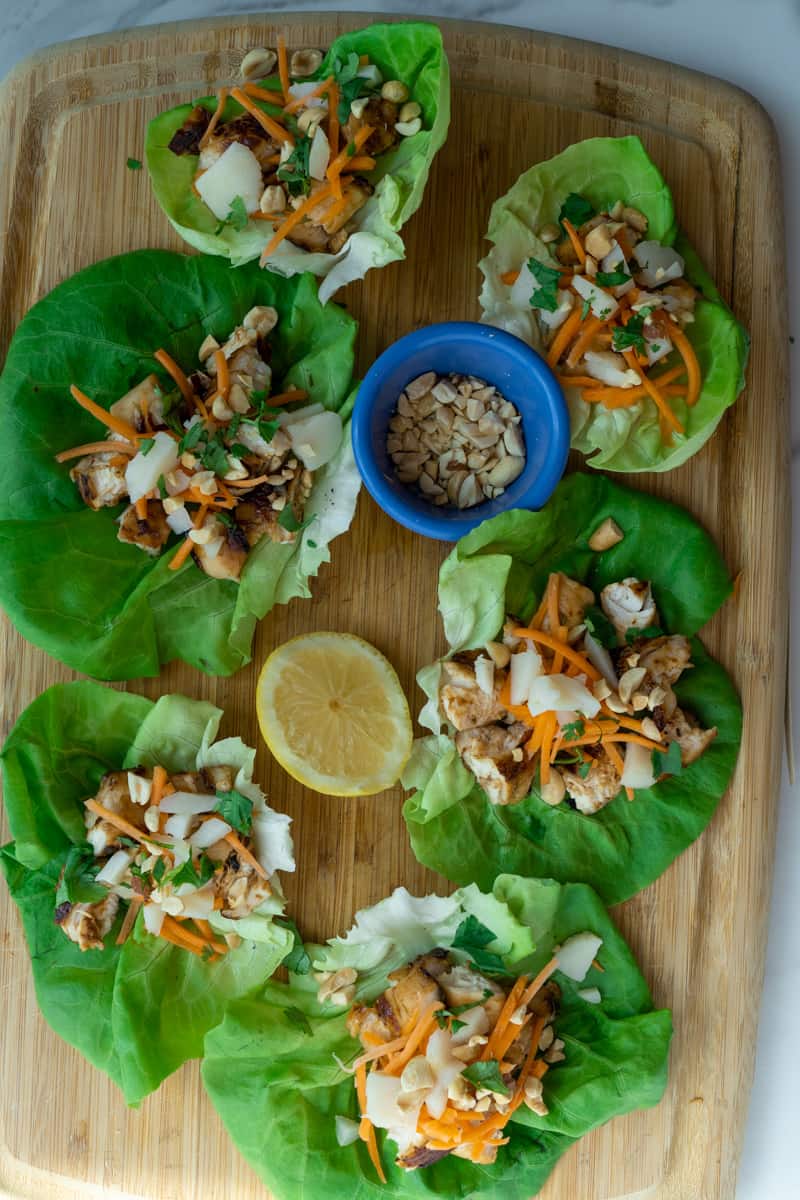 Garnish with the carrots, water chestnuts, peanuts, and cilantro. Squeeze lemon juice onto each. Enjoy these Teriyaki Chicken Lettuce wraps. 