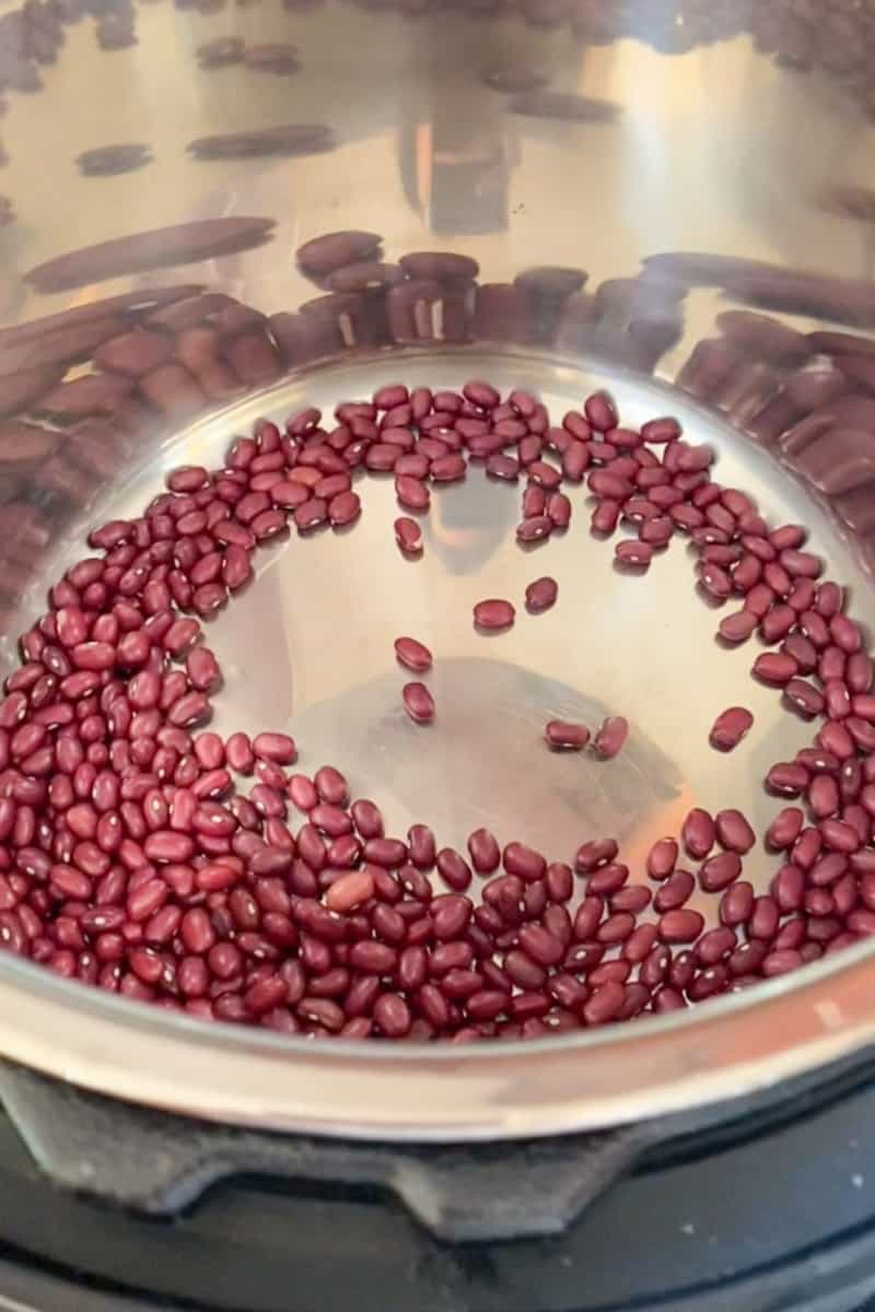 Add the kidney beans and water in the instant pot as well as the salt. 