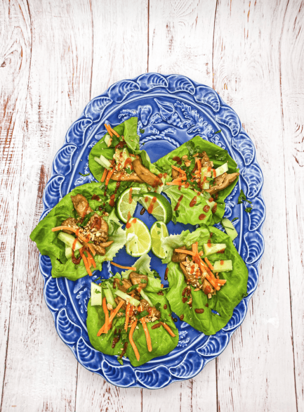 These Teriyaki Chicken Lettuce wraps marinated with sesame oil, soy sauce, Sriracha and garnished with peanuts, carrots and cucumber!