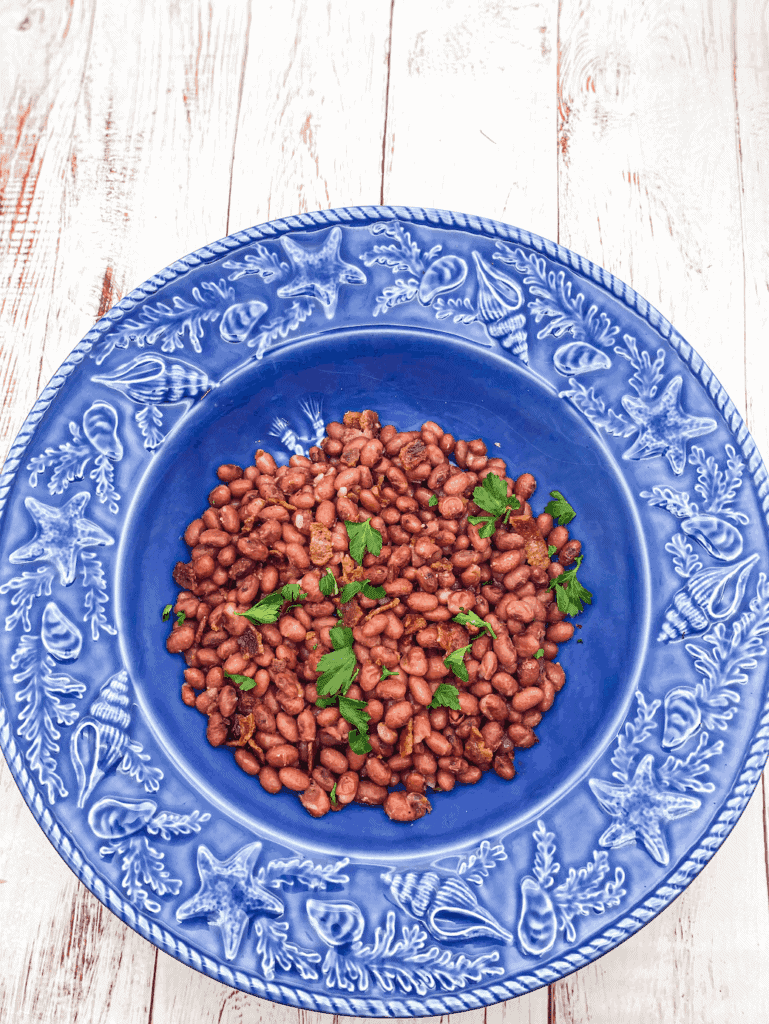 These dry red beans are cooked in the instant pot and then served with crumbled bacon, lemon, and parsley.