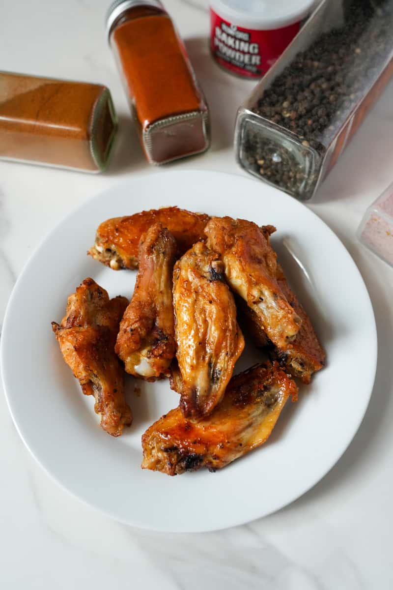 This Baked Chicken Wings Recipe is made with paprika, chili powder, and baking powder are great because they are crispy on the outside and juicy on the inside, with a delicious blend of spices that give them a bold and savory flavor.