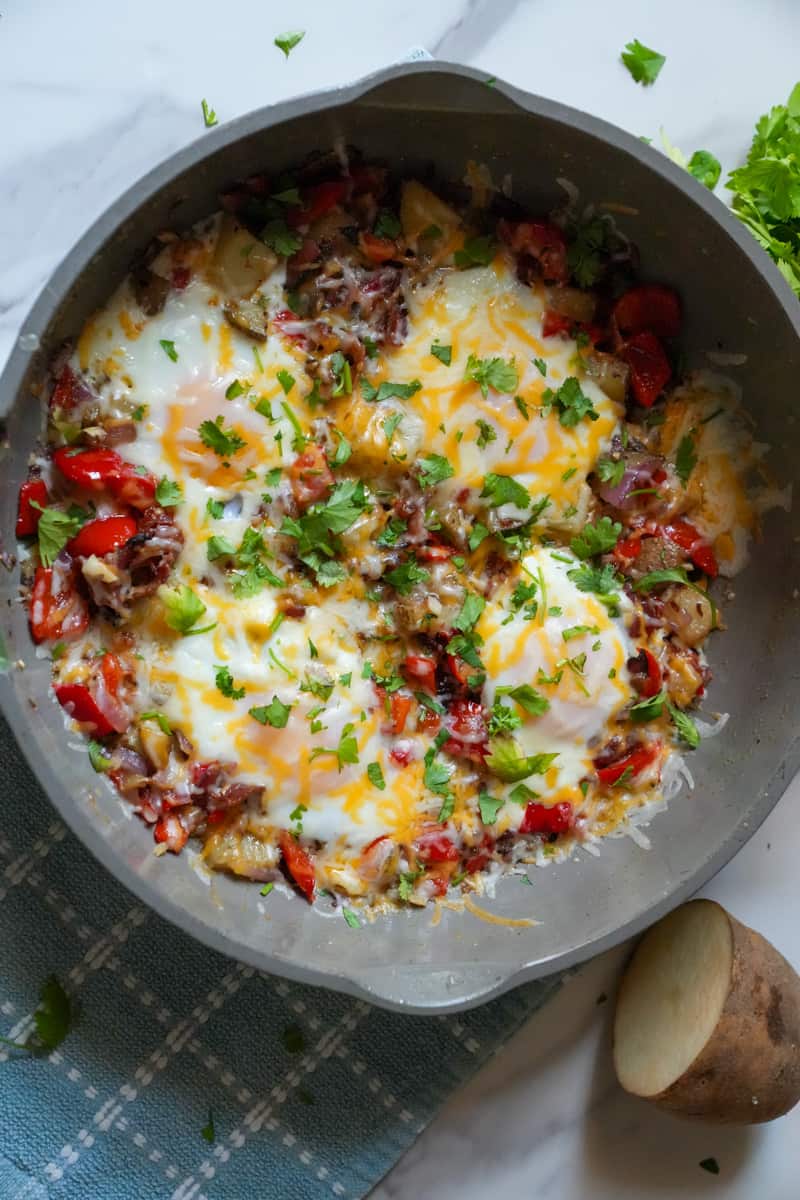 This is a Chorizo Breakfast Skillet Recipe with chorizo, bacon, potatoes, bell peppers, onion, garlic and cheese. 