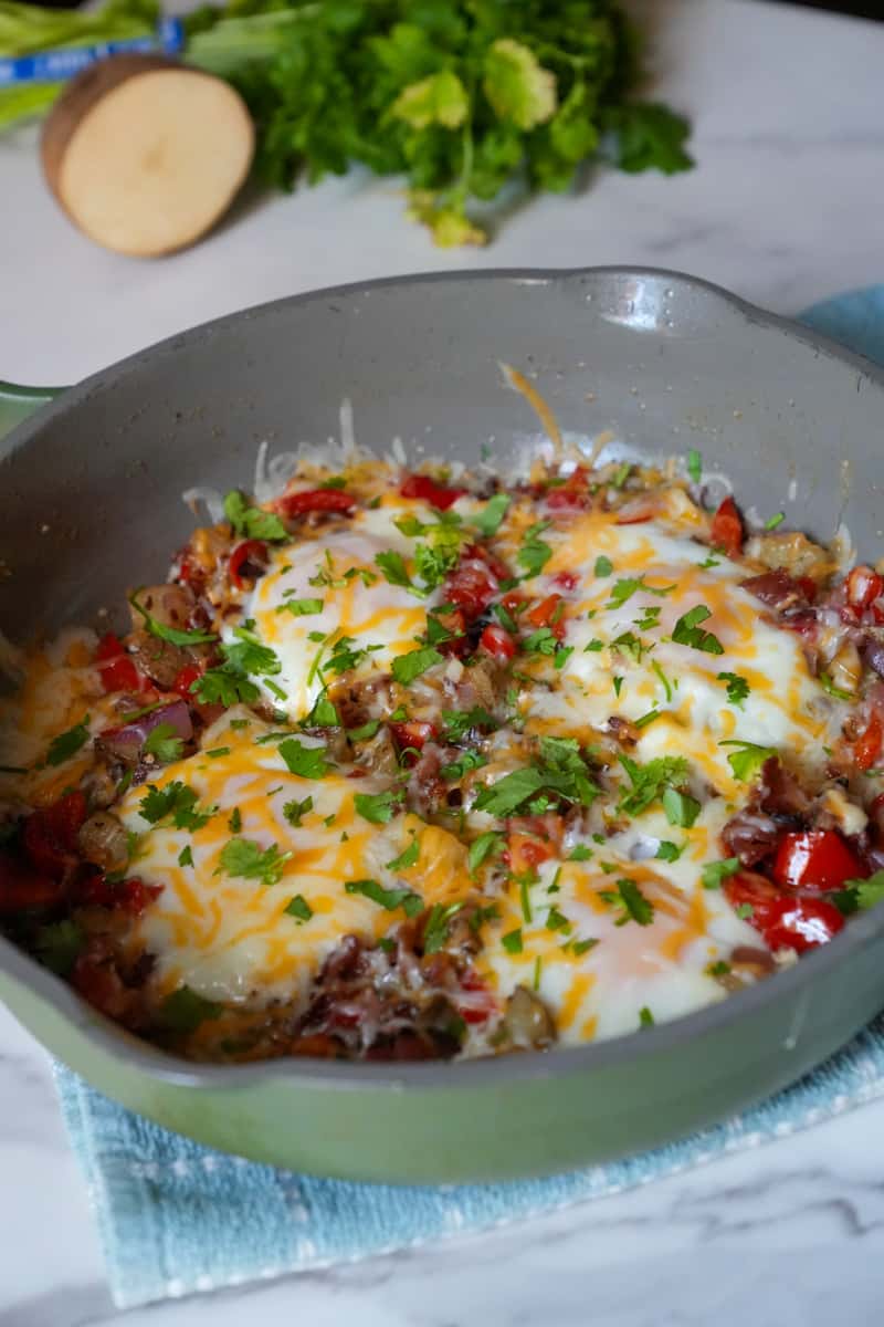 This is a Chorizo Breakfast Skillet Recipe with chorizo, bacon, potatoes, bell peppers, onion, garlic and cheese. 