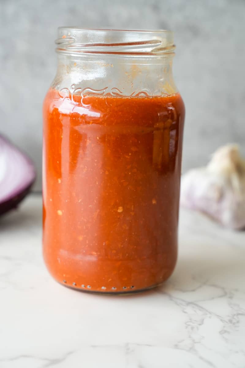 This Guajillo Sauce Recipe is made with guajillo chiles, garlic, onion, tomatoes, oregano, boiled and blended to perfection. 