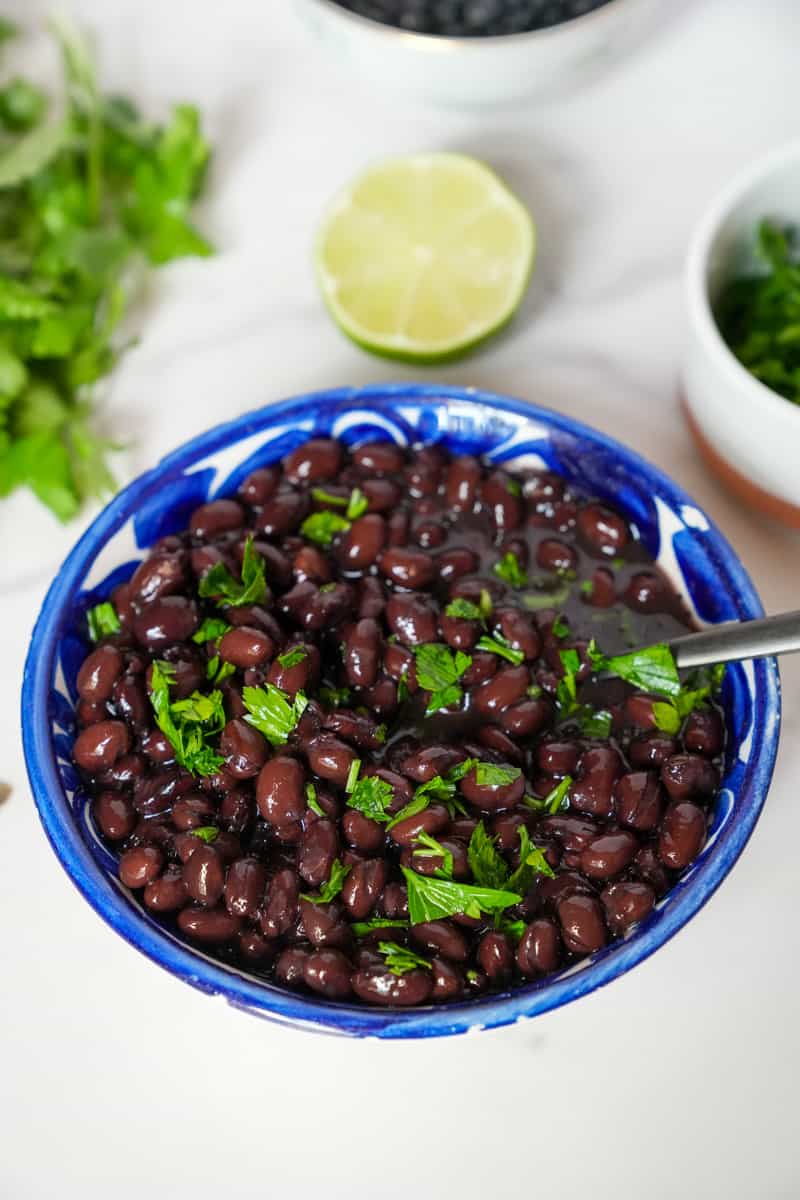 This Instant Pot Black Beans Recipe is made with dried black beans, lime, cilantro, broth and pressure cooked in an Instant Pot.