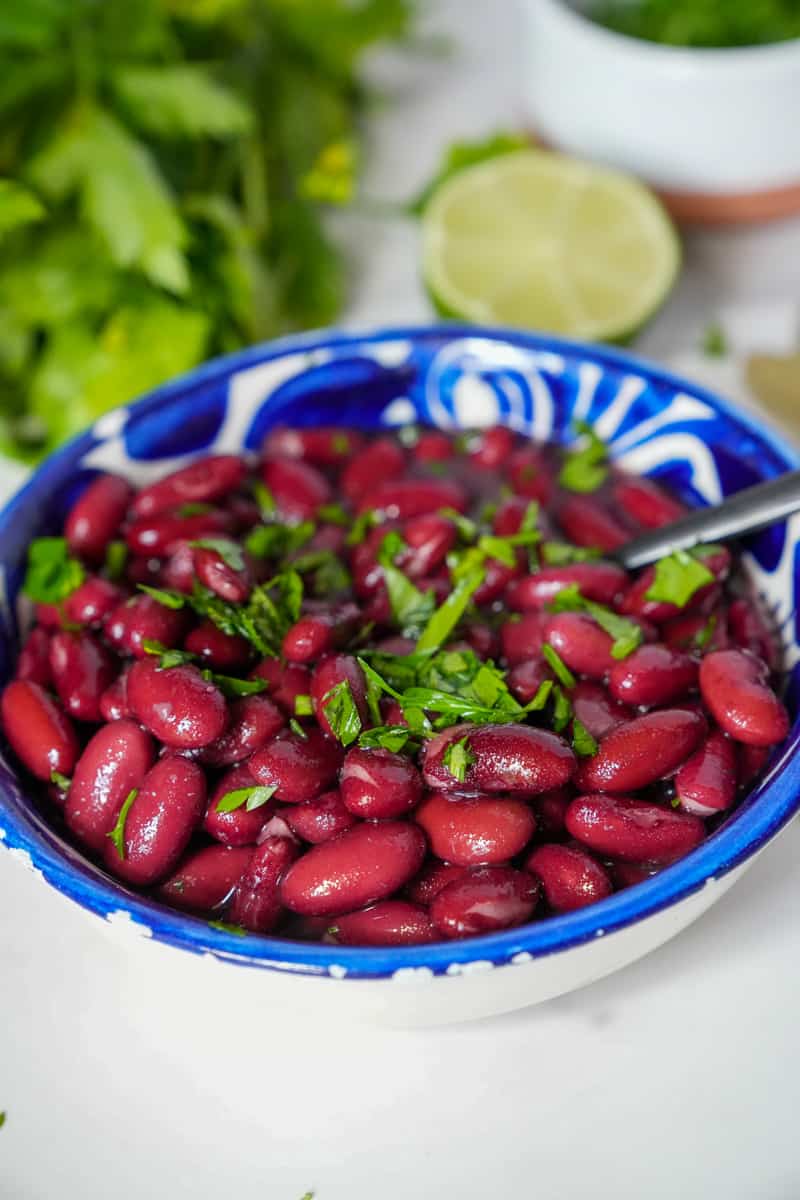 This Instant Pot Kidney Beans Recipe is made with lime, cilantro, black beans, and broth in an Instant Pot. 