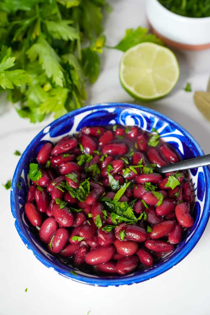 This Instant Pot Kidney Beans Recipe is made with lime, cilantro, black beans, and broth in an Instant Pot. 